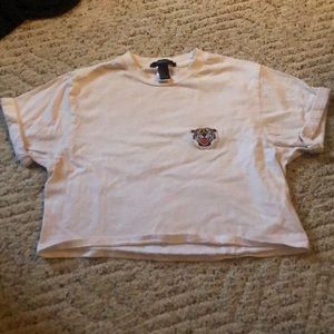 White crop top with tiger symbol